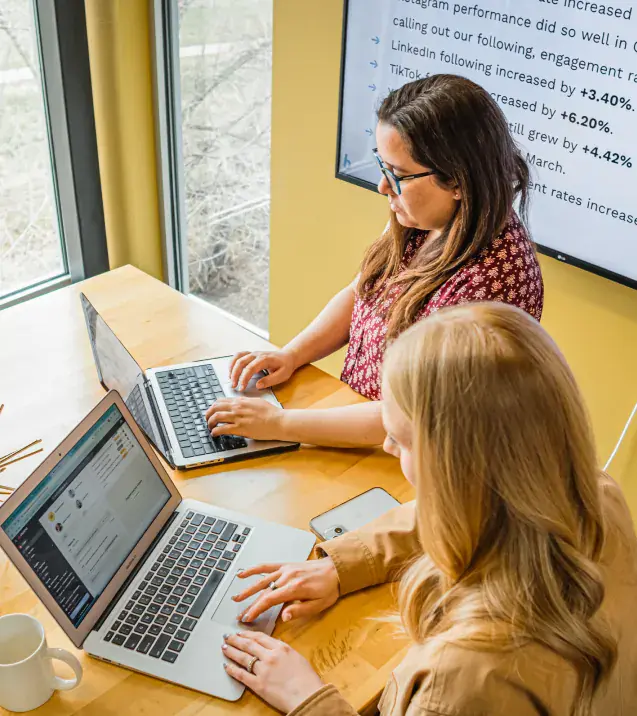 Brillity teammates reviewing performance reporting