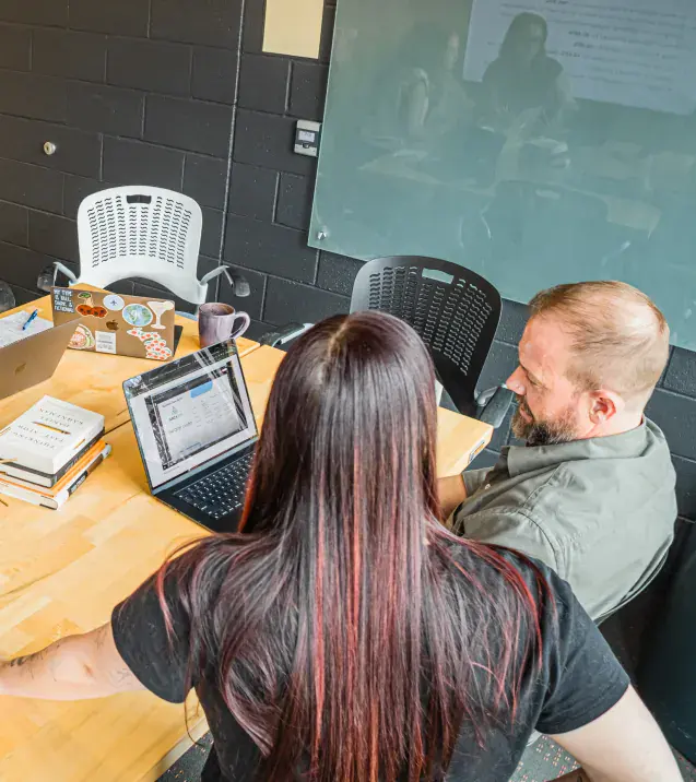 Brillity teammates reviewing results on screen