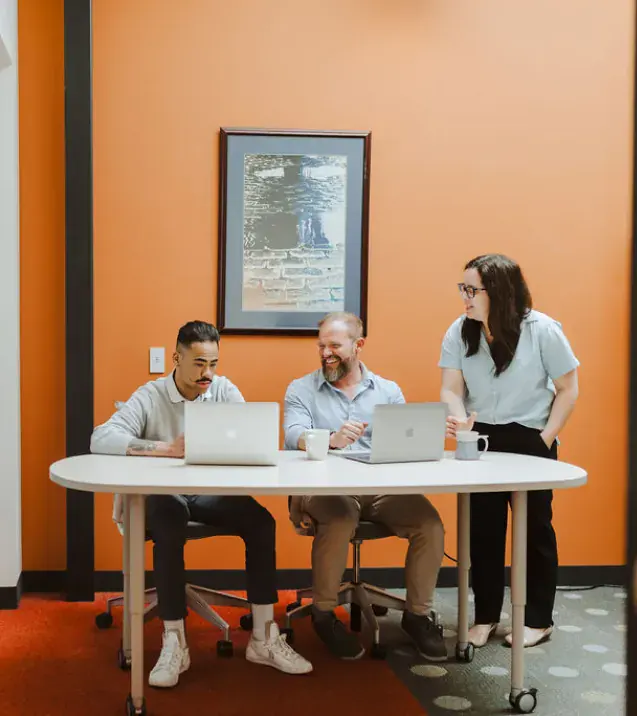 Brillity teammates working together at a table