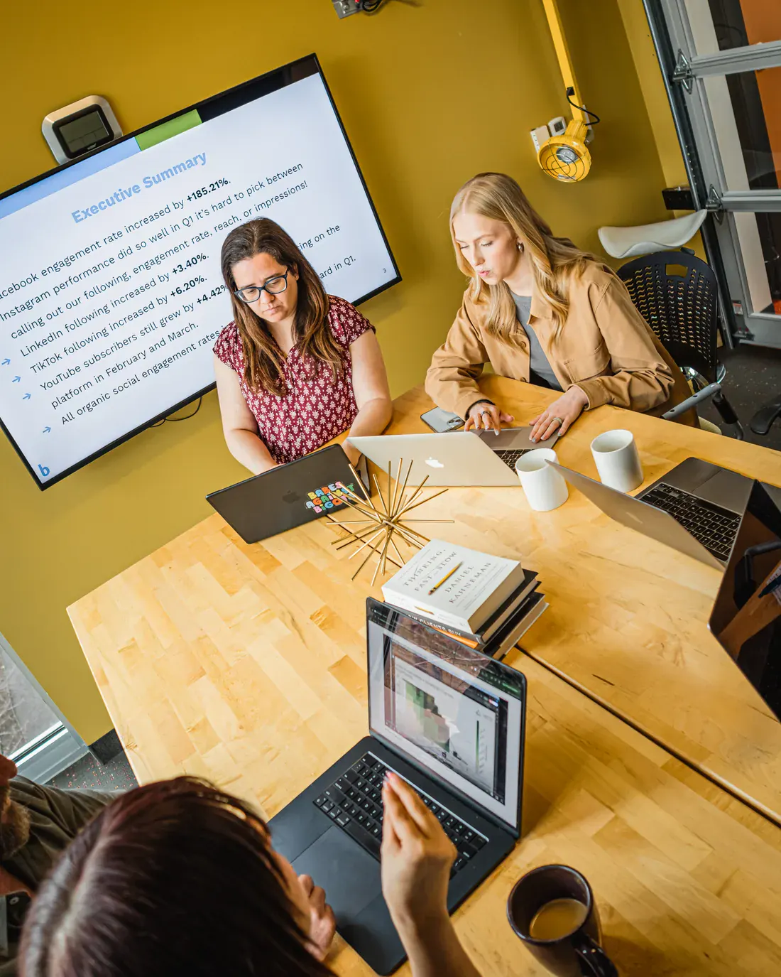 Overhead view of a Brillity Digital team meeting