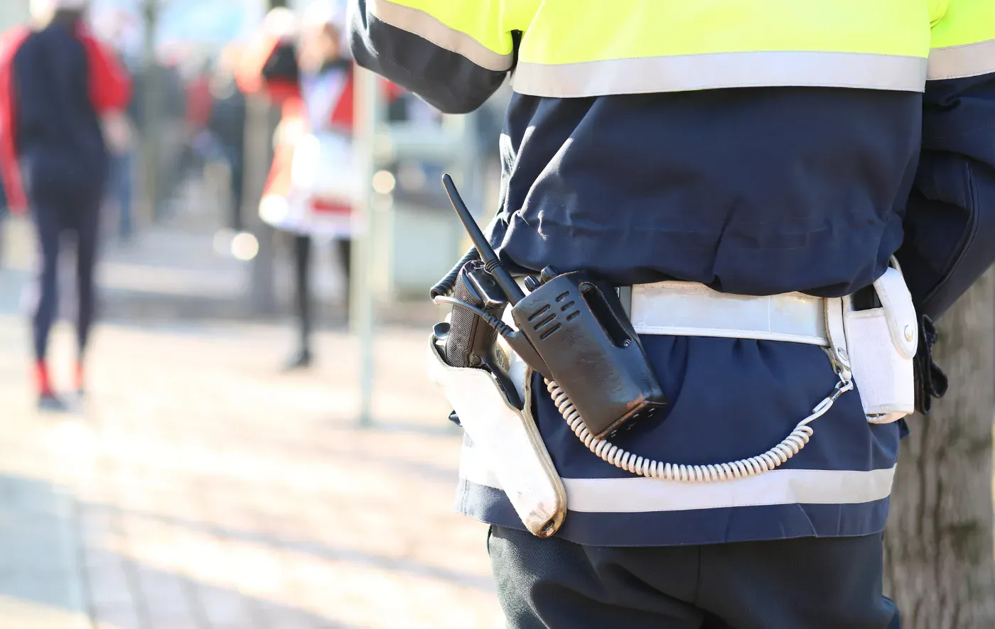 Security officer in uniform with a radio
